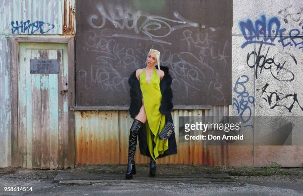 Imogen Anthony wears a dress by Wa La Land, coat by Femme Fatale and boots by Sugar Baby during Mercedes-Benz Fashion Week Resort 19 Collections at...