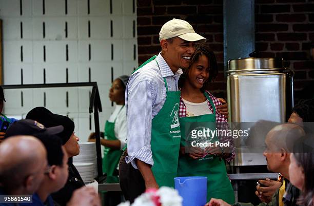President Barack Obama and his daughter Malia honor the Martin Luther King legacy by serving meals to the needy at a facility January 18, 2010 in...