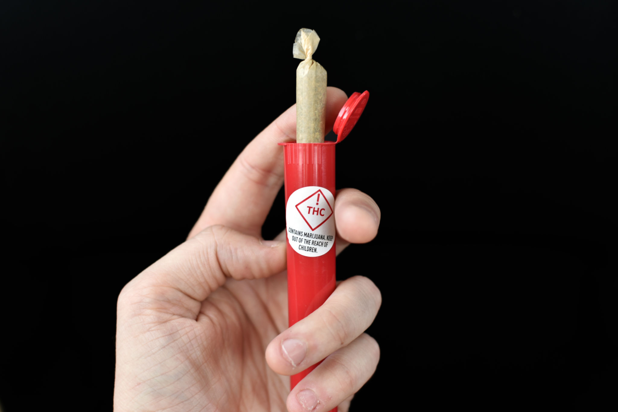 Red THC warning with marijuana joint container Red THC warning with marijuana joint container