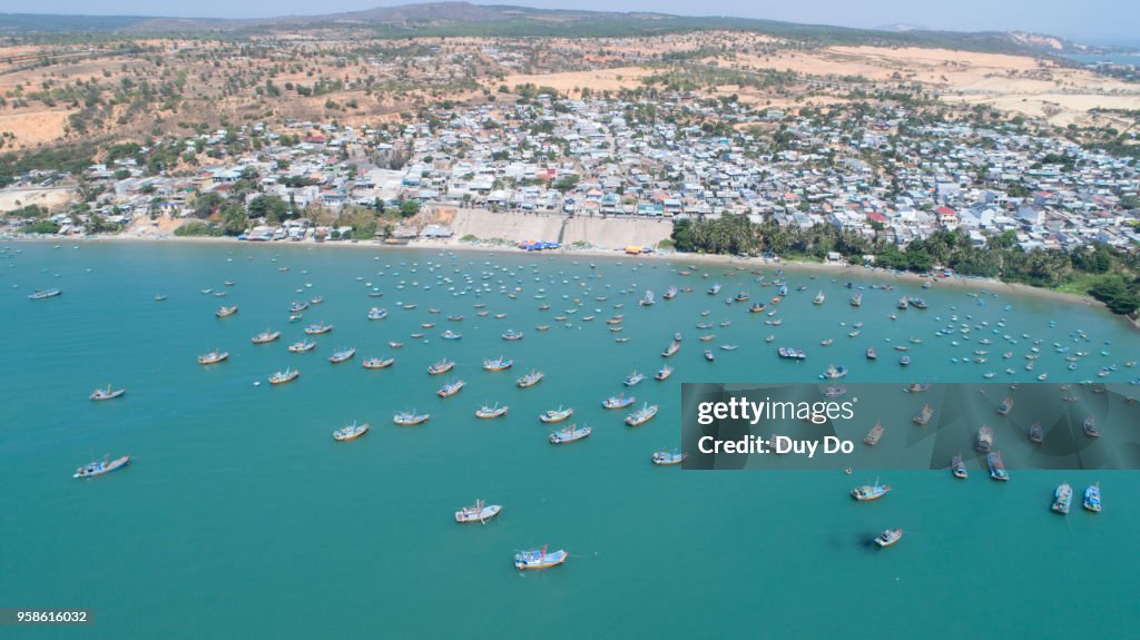 Drone photo of Mui Ne beach with fishing boat in Phan Thiet, Vietnam
