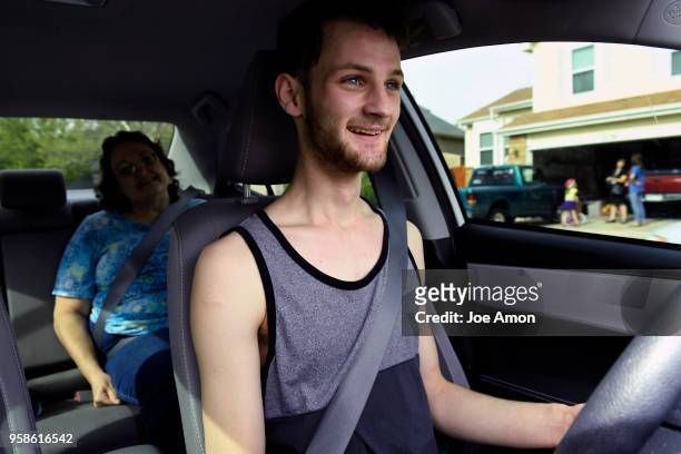 Elizabeth Pate 58, in the backseat as her adopted son Stephen Morgan 22, takes his 3rd driving lesson near their home in Broomfield. Stephen has had...