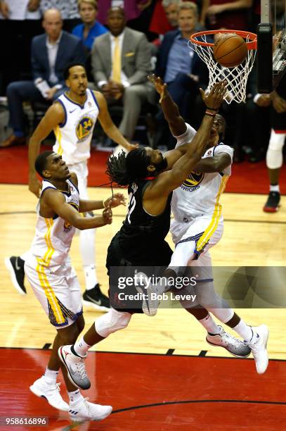 Nene Hilario of the Houston Rockets drives to the basket against Draymond Green of the Golden State Warriors in the second half in Game One of the...