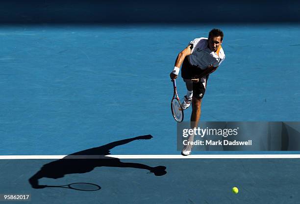 Sergiy Stakhovsky of the Ukraine serves in his first round match against Jo-Wilfried Tsonga of France during day two of the 2010 Australian Open at...