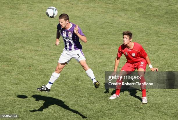 Steven Hesketh of the Glory heads the ball away from Evan Kostopoulos of United during the round 15 National Youth League match between Adelaide...