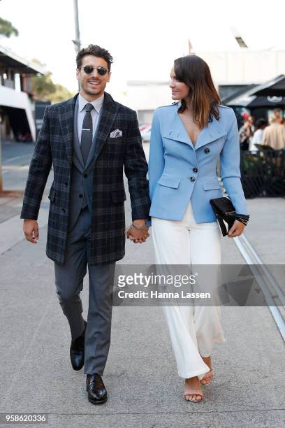 Matty Johnson wearing M.J. Bale. Suit and coat and Laura Byrne wearing Ginger and Smart jacket, Zimmerman pants, and ToniMay clutch and shoes during...