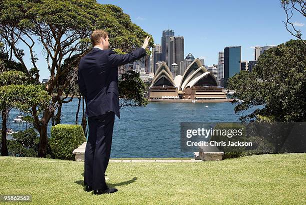 Prince William waves to a passenger boat while lunching at Admiralty House on January 19, 2010 in Sydney, Australia. HRH flew to Sydney today after...