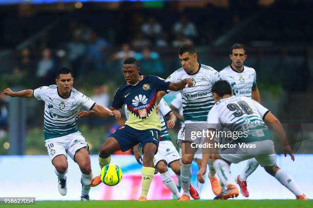 Andres Ibarguen of America struggles for the ball with Osvaldo Martinez and Gerardo Alcoba of Santos Laguna during the semifinals second leg match...