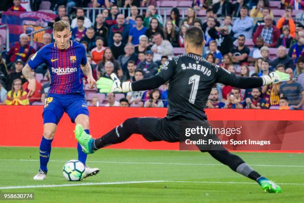 Goalkeeper Sergio Asenjo Andres of Villarreal CF reaches for the ball after an attempt at goal by Lucas Digne of FC Barcelona during the La Liga...