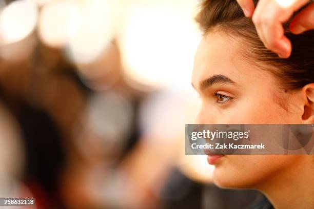 Model prepares backstage ahead of the Matchesfashion.com x Emilia Wickstead show at Mercedes-Benz Fashion Week Resort 19 Collections at Wylie's Baths...