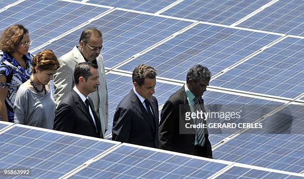 French President Nicolas Sarkozy , Junior Minister for Ecology Chantal Jouanno and Overseas Territories Minister Marie-Luce Penchard visit a solar...