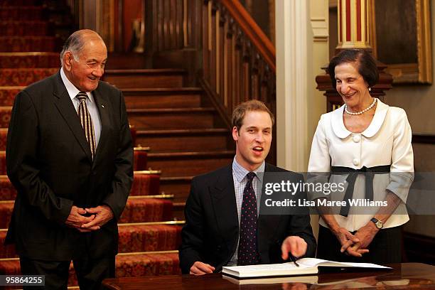 Prince William signs a guest book at Government House with Sir Nicholas Shehadie AC OBE and Her Excellency Marie Bashir AC CVO on the first day of...