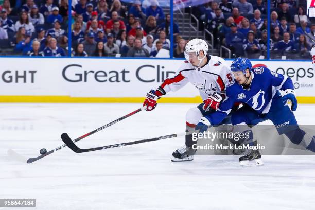 Yanni Gourde of the Tampa Bay Lightning against Dmitry Orlov the Washington Capitals during Game Two of the Eastern Conference Final during the 2018...