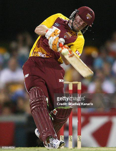 Ben Dunk of the Bulls drives during the Twenty20 Big Bash match between the Queensland Bulls and the Victorian Bushrangers at The Gabba on January...