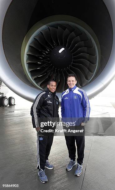 Dennis Aogo and goalkeeper Frank Rost pose in front of the engine during the hand over of the A380 to the Emirates airline on January 18, 2010 in...