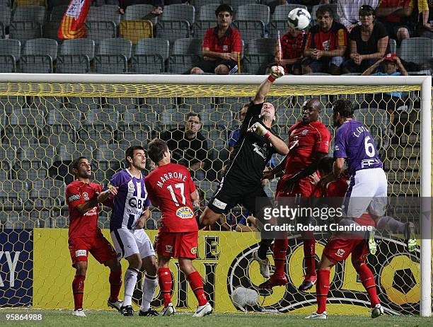 Adelaide United goalkeeper Eugene Galekovic punches the ball during the round 19 A-League match between Adelaide United and Perth Glory at Hindmarsh...