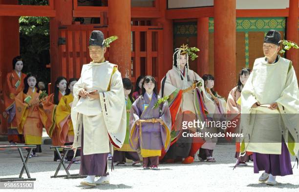 Shiho Sakashita , a 23-year-old office worker playing the role of the "Saio-dai" imperial princess in the annual Aoi festival in Kyoto, heads to a...