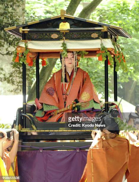 Float carrying Shiho Sakashita, a 23-year-old office worker playing the role of the "Saio-dai" imperial princess in the annual Aoi festival in Kyoto,...