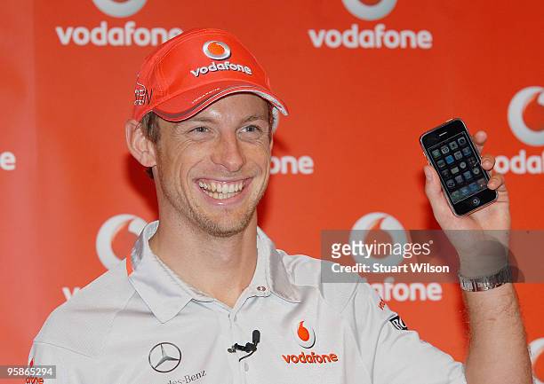 Formula 1 2009 World Champion racing driver Jenson Button attends photocall to launch iPhone availablity on Vodafone on January 19, 2010 in London,...