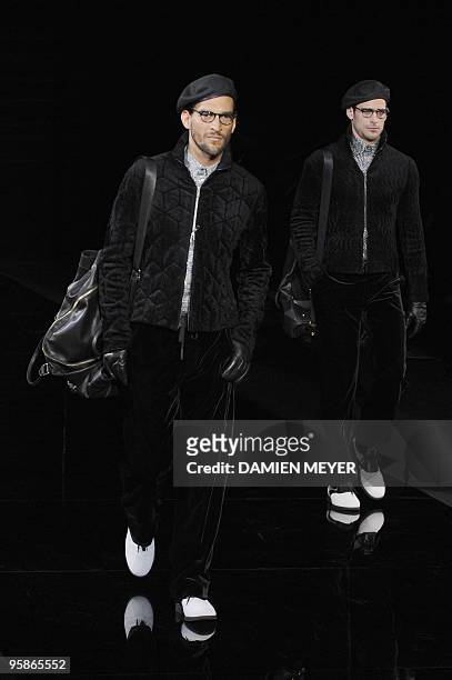 Models display creations as part of Armani Fall-Winter 2010-2011 Menswear collection on January 19, 2010 during the Men's fashion week in Milan. AFP...