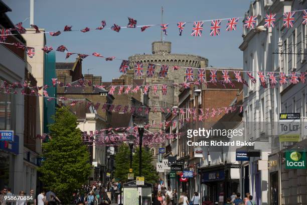 Union jack bunting hangs between shops as the royal town of Windsor gets ready for the royal wedding between Prince Harry and his American fiance...