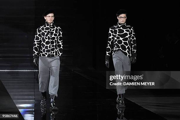 Models display creations as part of Armani Fall-Winter 2010-2011 Menswear collection on January 19, 2010 during the Men's fashion week in Milan. AFP...