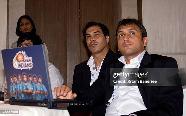 Rahul Sanghvi and Robin Singh of the Mumbai Indians team watch proceedings at the Indian Premier League Auction 2010 on January 19, 2010 in Mumbai,...