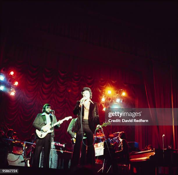Singer Frankie Valli performs on stage with the Four Seasons in the 1970's.