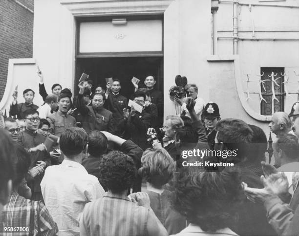 British supporters of the communist People's Republic of China listen as a Chinese diplomat exclaims 'Long live Chairman Mao', outside the Chinese...