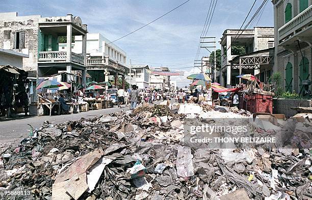 Trash is strewn on a street 26 December 2001 in Port-au-Prince, Haiti. The US government has advised that unless progress was made on Haitian...