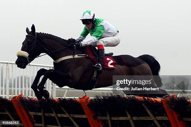 Mark Quinlan and Ban Uisce clear the last flight before going on to win The Betfair Conditional Jockeys' Training Series Handicap Hurdle Race run at...