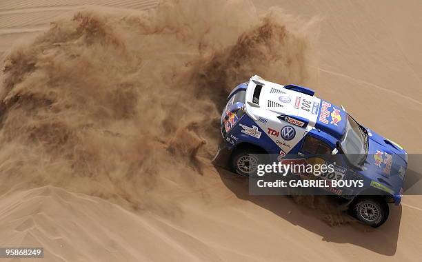 Spain's Carlos Sainz steers his Volkswagen during the sixth stage of the Dakar 2010, between Antofagasta and Iquique in Chile, on January 7, 2010....