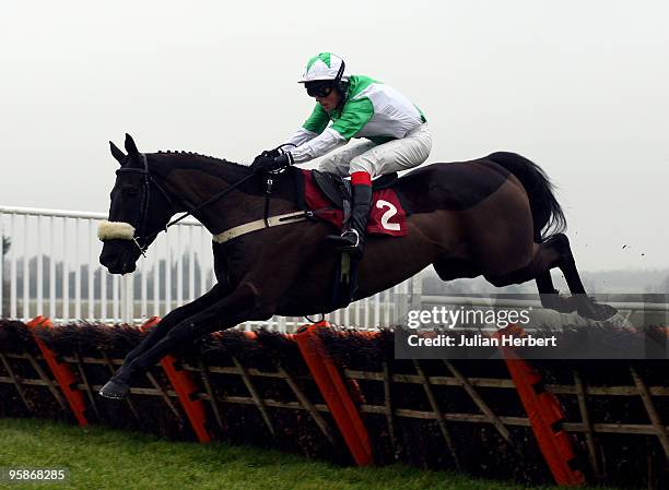 Mark Quinlan and Ban Uisce clear the last flight before going on to win The Betfair Conditional Jockeys' Training Series Handicap Hurdle Race run at...