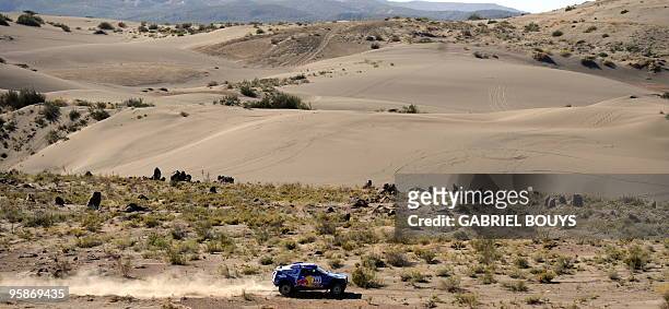 Spain's Carlos Sainz steers his Volkswagen during the 13th stage of the Dakar 2010, between San Rafael and Santa Rosa, Argentina on January 15, 2010....