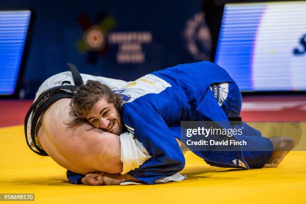 Defending European champion, Hidayat Heydarov of Azerbaijan controls the upper body of Vadzim Shoka of Belarus to hold him for an ippon to advance to...