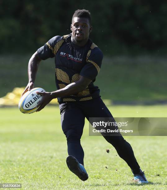 Christian Wade passes the ball during the Wasps training session held at their training ground on May 15, 2018 in Coventry, England.