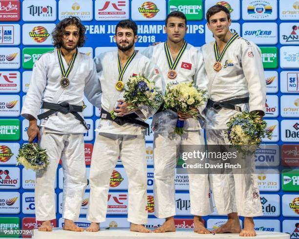 Under 73kg medallists L-R: Silver; Hidayat Heydarov , Gold; Ferdinand Karapetian , Bronzes; Bilal Ciloglu and Tommy Macias during day two of the 2018...