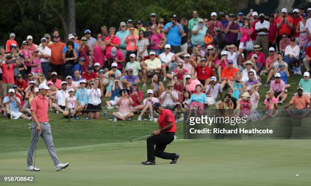 Tiger Woods of the United States reacts to just missing an eagle putt on the 11th green during the final round of THE PLAYERS Championship on the...
