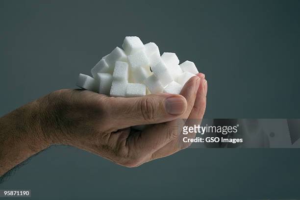 handfull of sugar cubes - suiker stockfoto's en -beelden