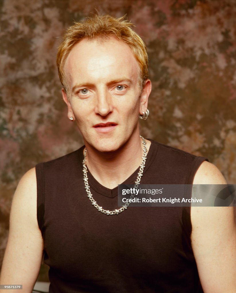 Posed portrait of Phil Collen, guitarist with British band Def... News