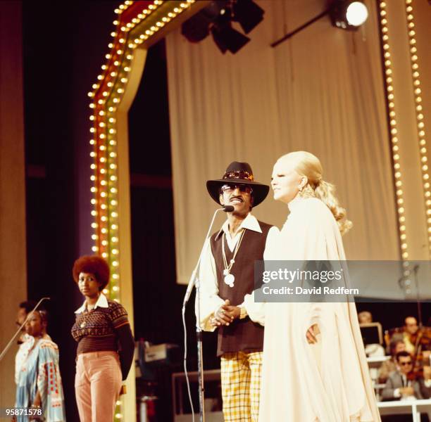 From left, American singers Aretha Franklin , Sammy Davis Jr. And Peggy Lee perform on stage during the 'Duke Ellington...We Love You Madly' tribute...