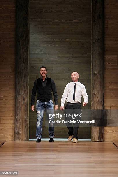 Designers Stefano Gabbana and Domenico Dolce acknowledge the applause of the public after the D&G Milan Menswear Autumn/Winter 2010 show on January...
