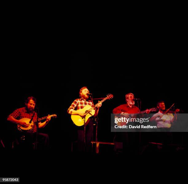 Barney McKenna, Sean Cannon, Ronnie Drew and John Sheahan of the Dubliners perform on stage at the Dominion Theatre in London, England in March 1985.