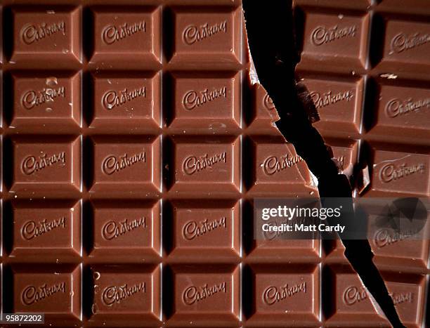 In this photograph illustration a bar of Cadbury's Dairy Milk chocolate is broken in half on January 19, 2010 in Bristol, England. The US food giant...