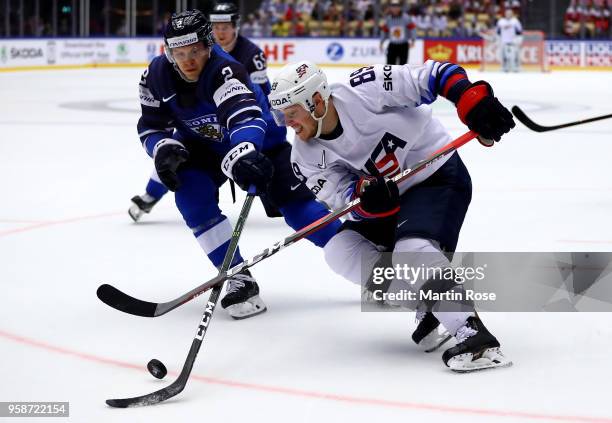 Ville Pokka of Finland and Cam Atkinson of the United States battle for the puck during the 2018 IIHF Ice Hockey World Championship Group B game...