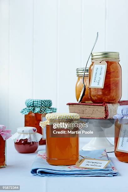 selection of marmalades on table - marmalade stock pictures, royalty-free photos & images