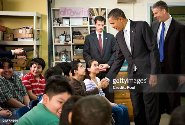 President Barack Obama and Secretary of Education Arne Duncan visits with sixth grade students at the Graham Road Elementary School January 19, 2010...