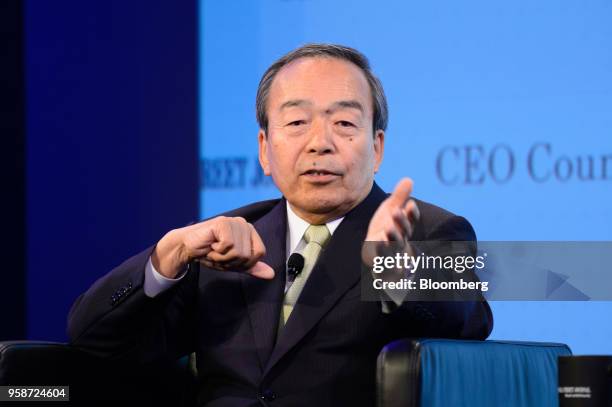 Takeshi Uchiyamada, chairman of Toyota Motor Corp., gestures while speaking during the Wall Street Journal CEO Council in Tokyo, Japan, on Tuesday,...