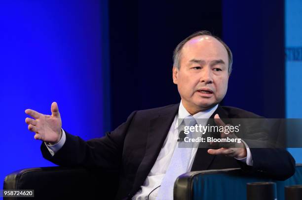 Masayoshi Son, chairman and chief executive officer of SoftBank Group Corp., gestures while speaking during the Wall Street Journal CEO Council in...