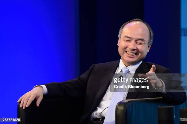 Masayoshi Son, chairman and chief executive officer of SoftBank Group Corp., reacts during the Wall Street Journal CEO Council in Tokyo, Japan, on...