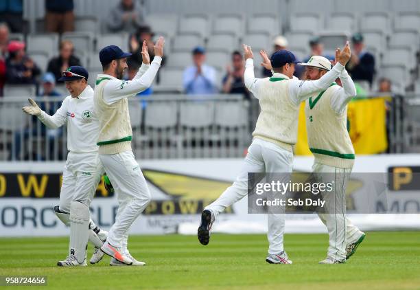Dublin , Ireland - 15 May 2018; Paul Stirling, right, is congratulated by Ireland captain William Porterfield after catching out Azhar Ali of...